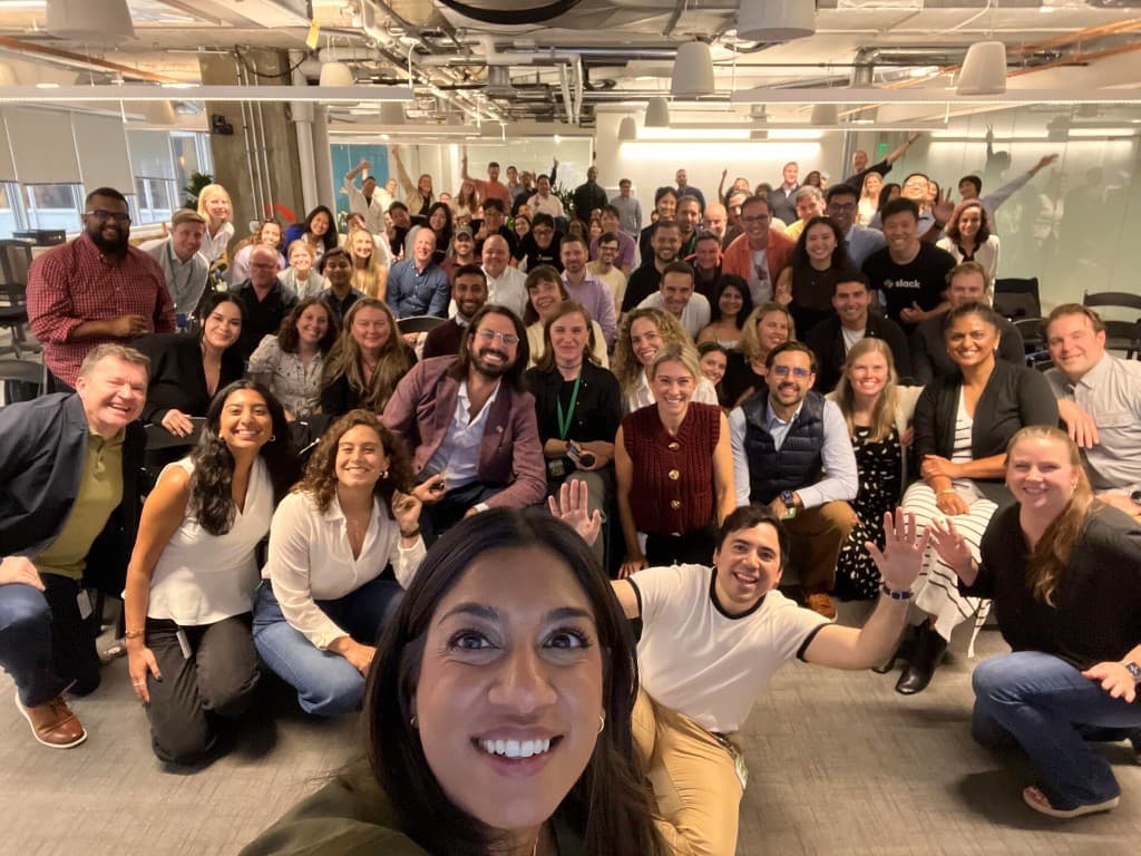 Slack Global SE Office 2025 group selfie in a bright open-plan office